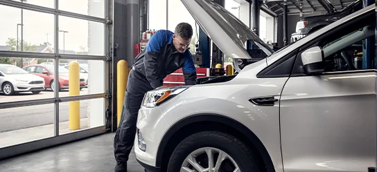 Service Tech under a hood