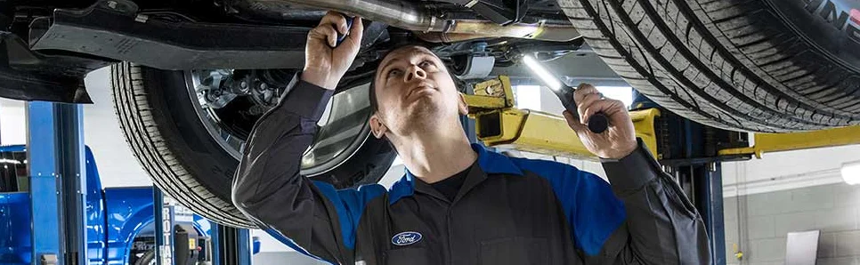 Service Tech working on a vehicle