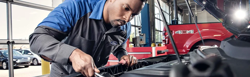 Service Tech under a hood