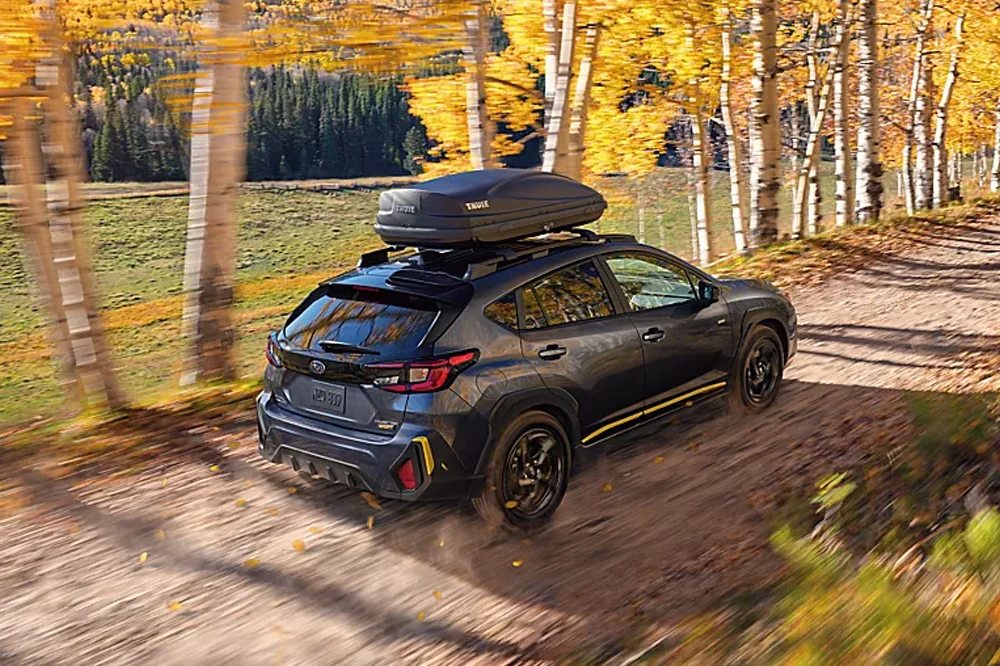 Subaru Crosstrek driving on a dirt road