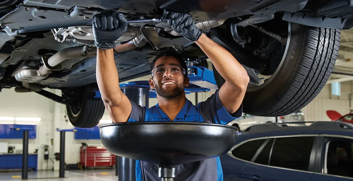 Subaru Service Coupons Technician Checking Under Vehicle