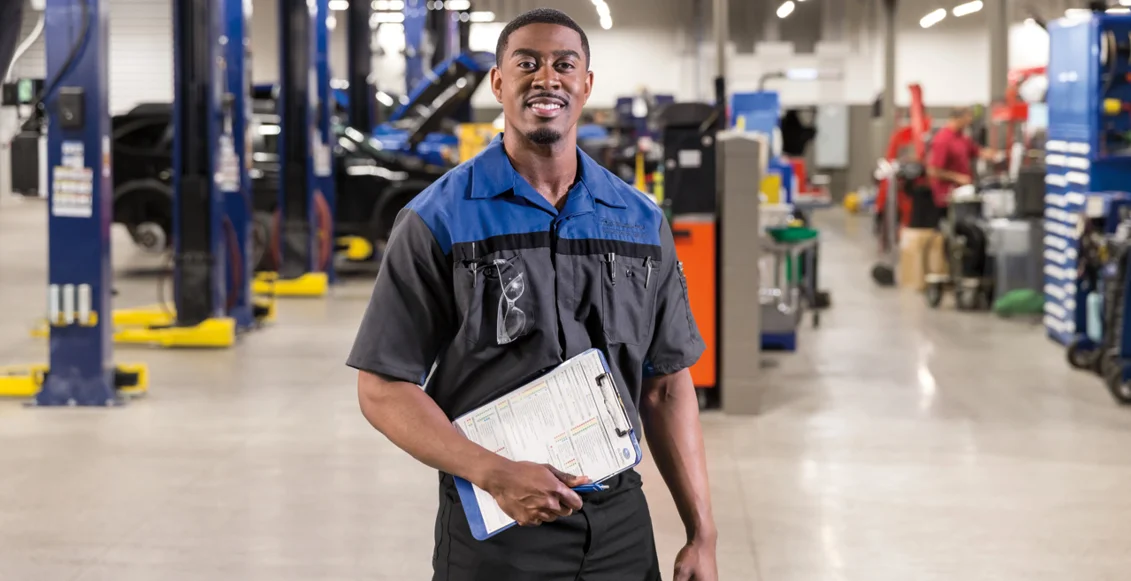 Check Your Vehicle For Recalls Service Tech with Clipboard