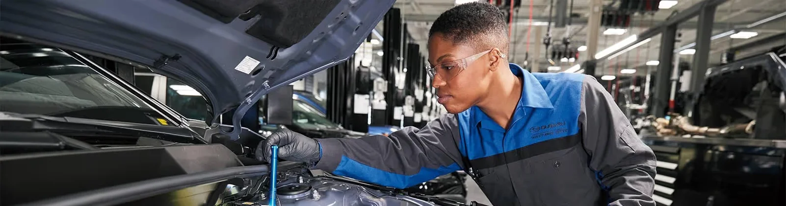 Why Choose Milea Subaru for Your Subaru Service? Service Tech Checking Oil