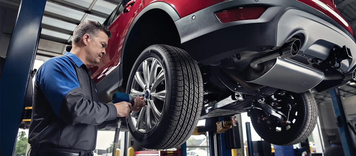 Ford Service Tech working on a car