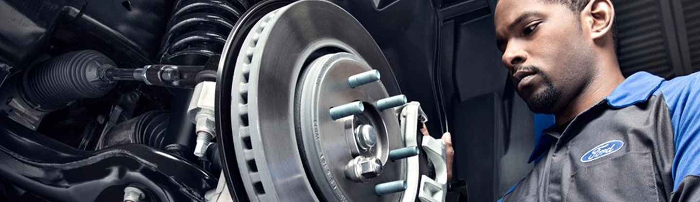 Ford Service Tech working on brakes