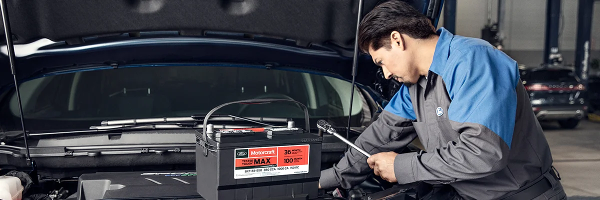 Ford Service Tech working on a car