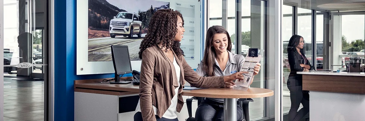Ford Service Tech talking to a customer