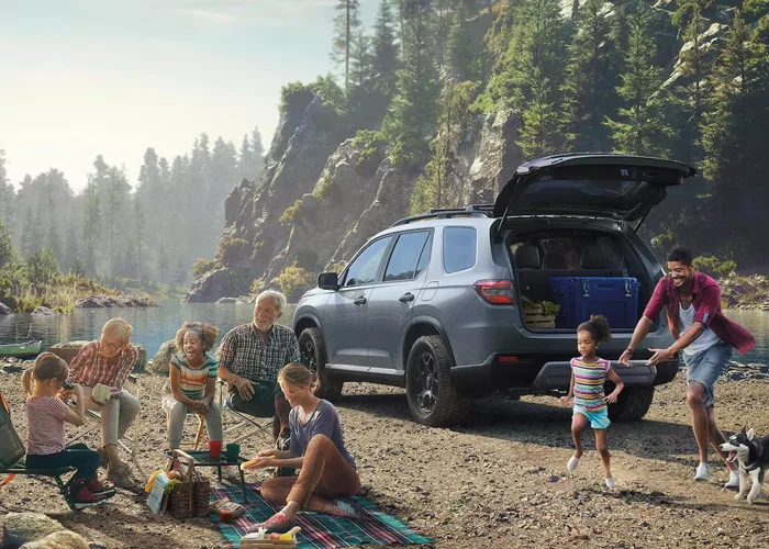 Honda Pilot parked by a lake