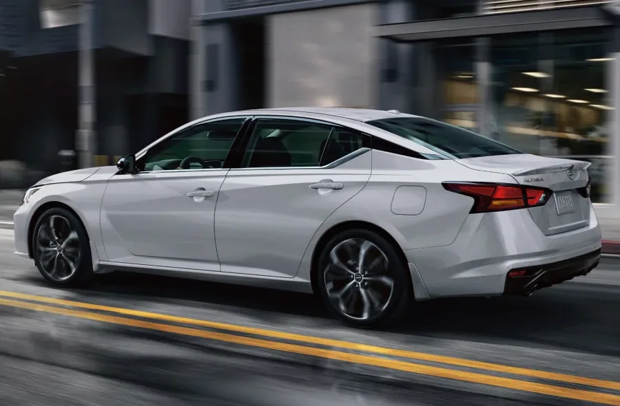 Nissan Altima driving on a city street