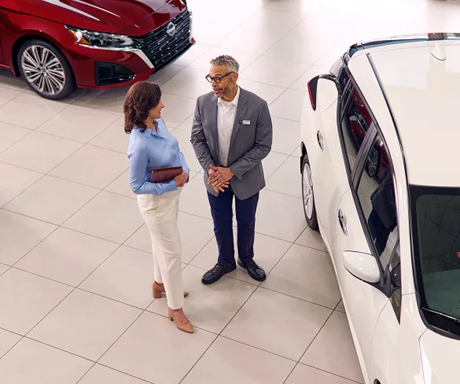 Nissan Employee Working With Customer