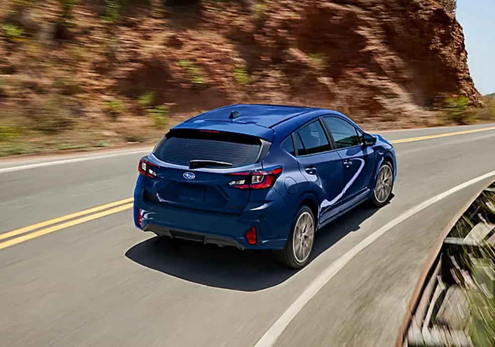 Subaru Impreza driving down the road