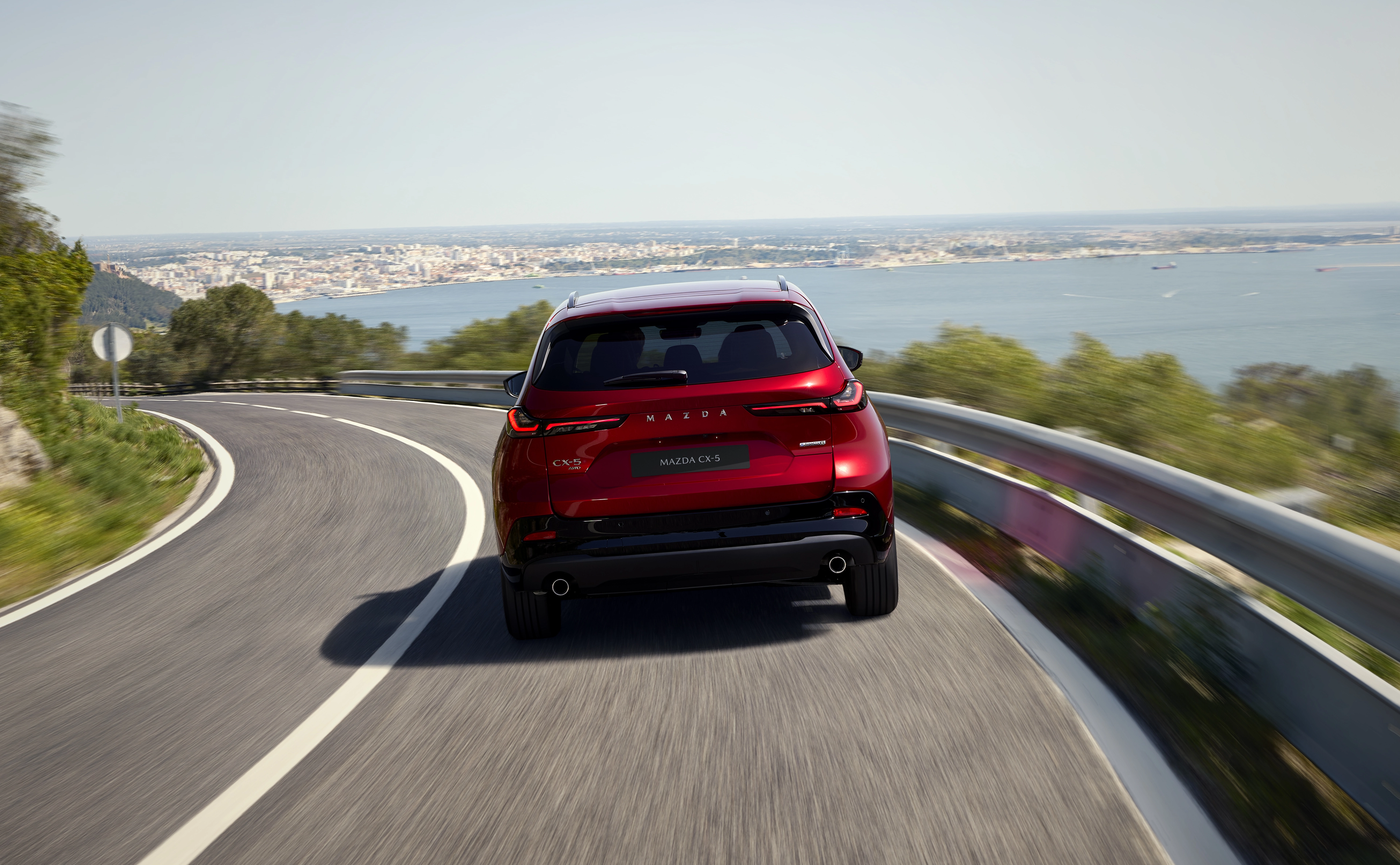 2026 Mazda CX-5 driving from the back
