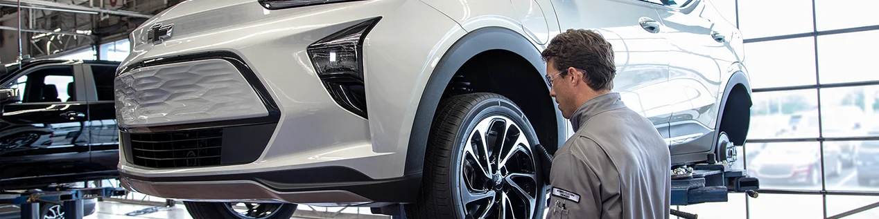 Chevy Service Tech working on a car