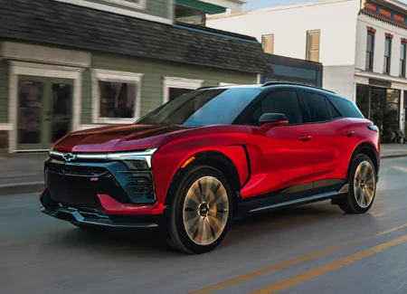 Chevy Driving Down Street