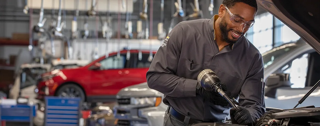 Tech working on a car