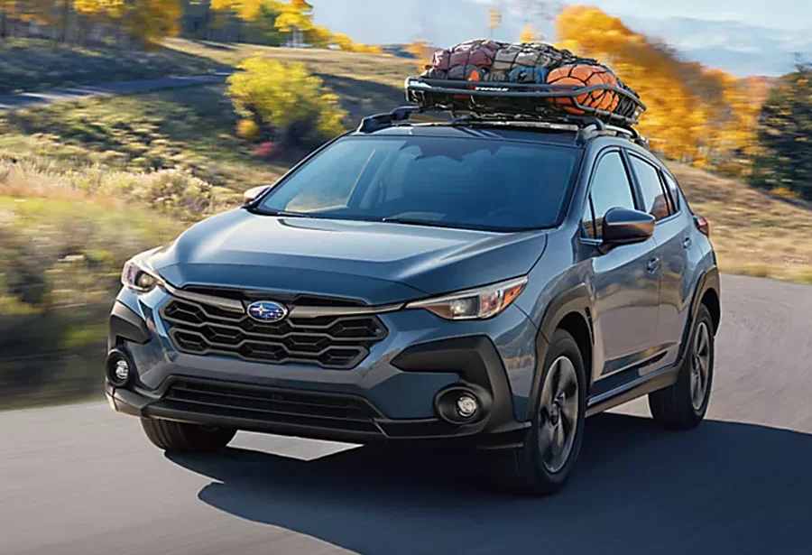 Subaru Outback Driving Down Country Road