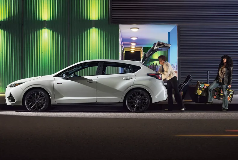 People Loading Music Equipment into Trunk of a 2025 Subaru Impreza