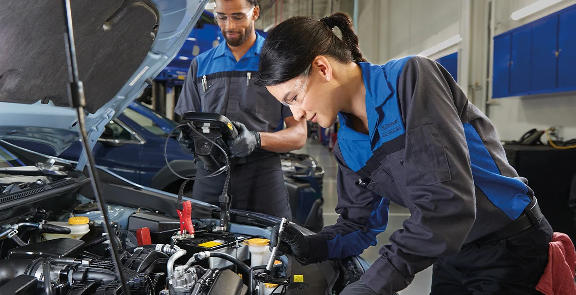 Technician Checking Under Vehicle