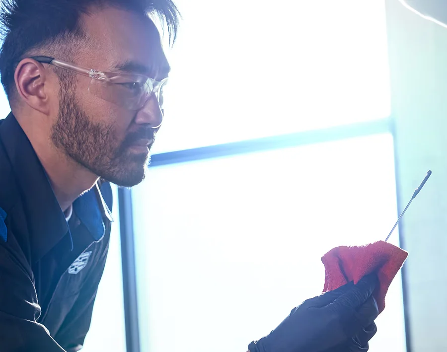 Cadillac service technician Working on a car
