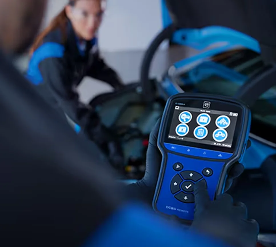 Cadillac service technician working on a car