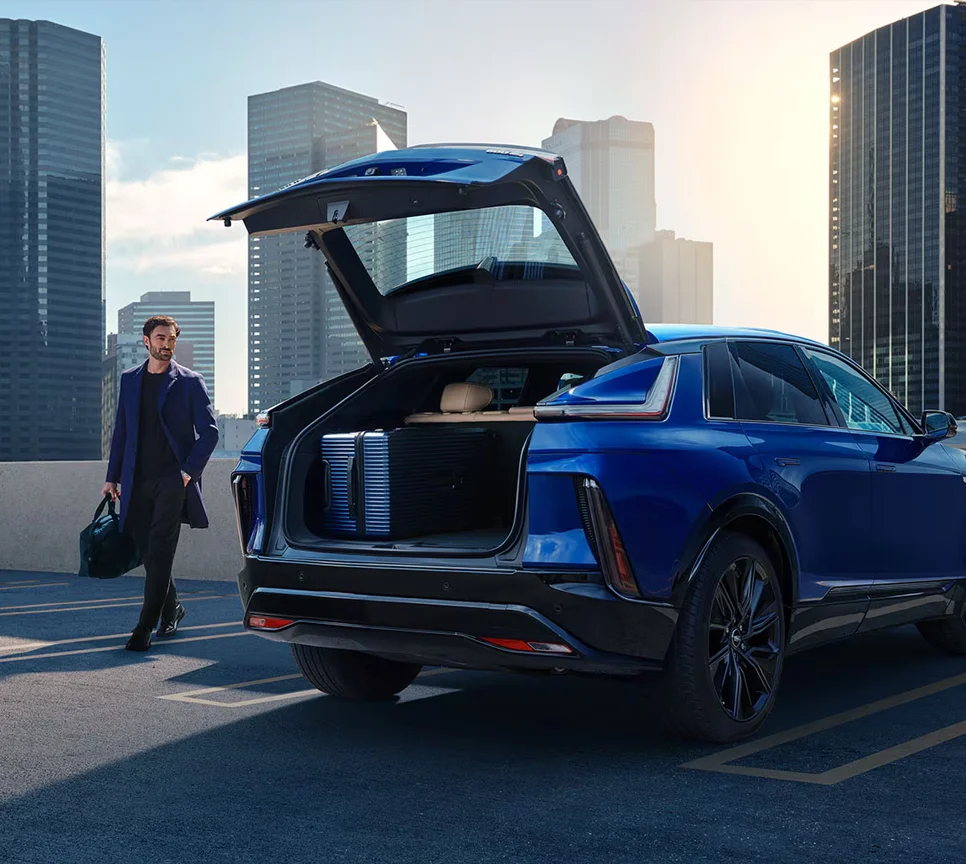 Loading Luggage Into Cadillac