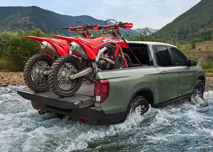 2026 Honda Ridgeline with dirtbikes in the back