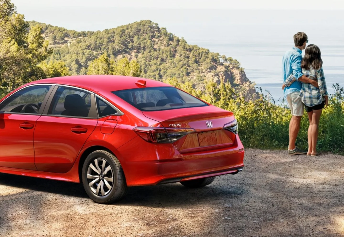 Couple Next to Honda Civic