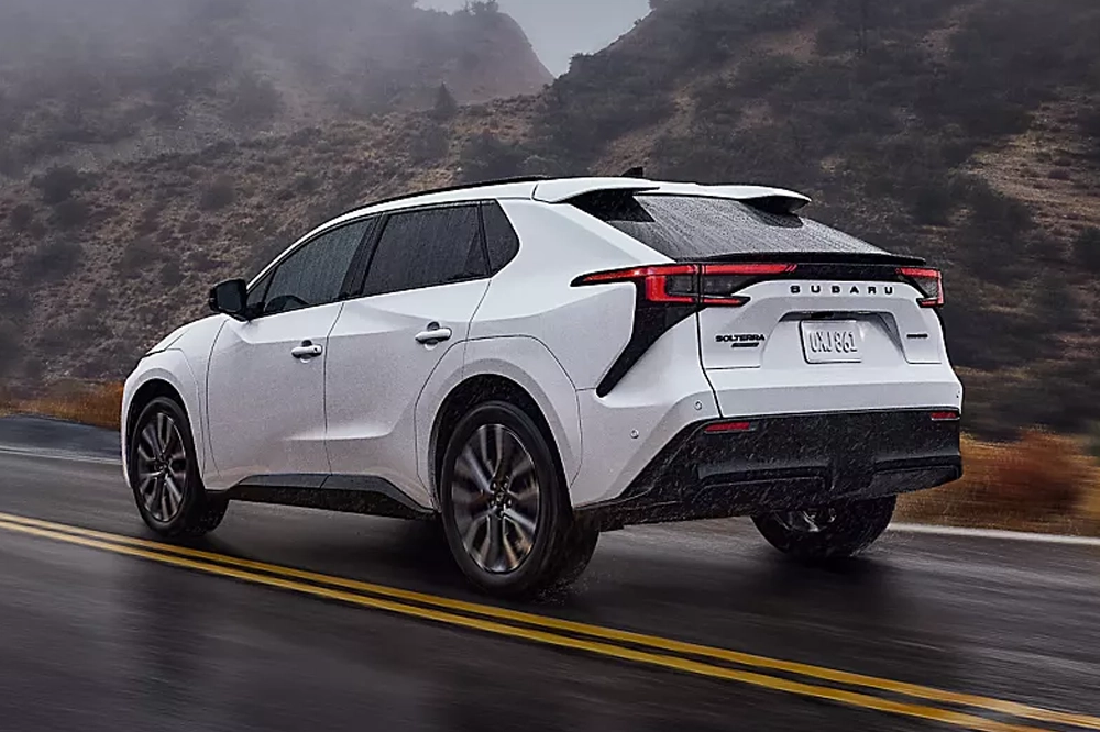 Subaru Solterra driving from the back