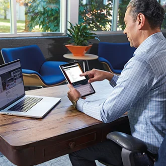 Man at home on a tablet