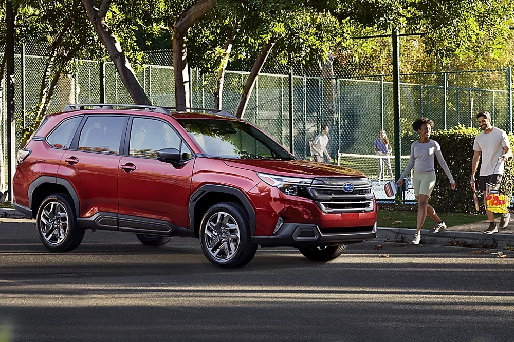 Subaru Forester parked by a tennis court