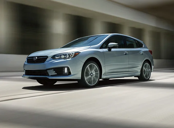 Pre-Owned Subarus Subaru Legacy driving down road