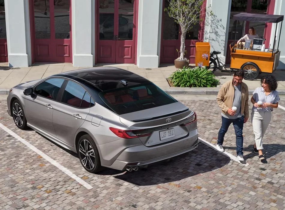 Couple Walking From 2026 Toyota Camry