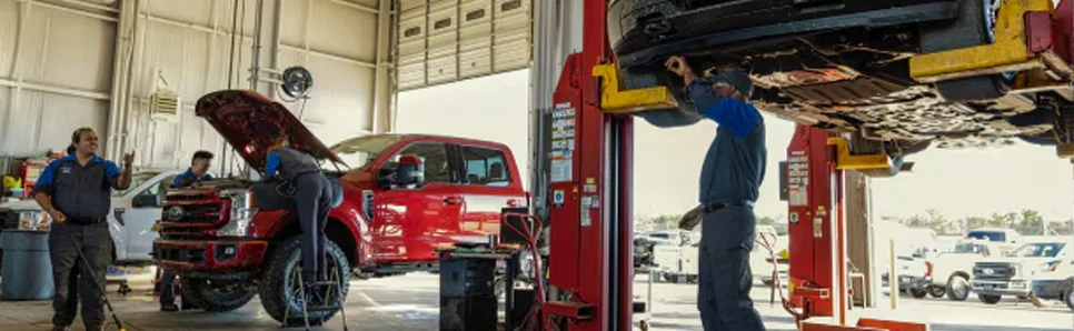 Service Tech under a hood