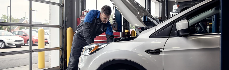 Service Tech under a hood