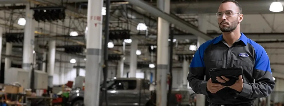 Service Tech working on a vehicle