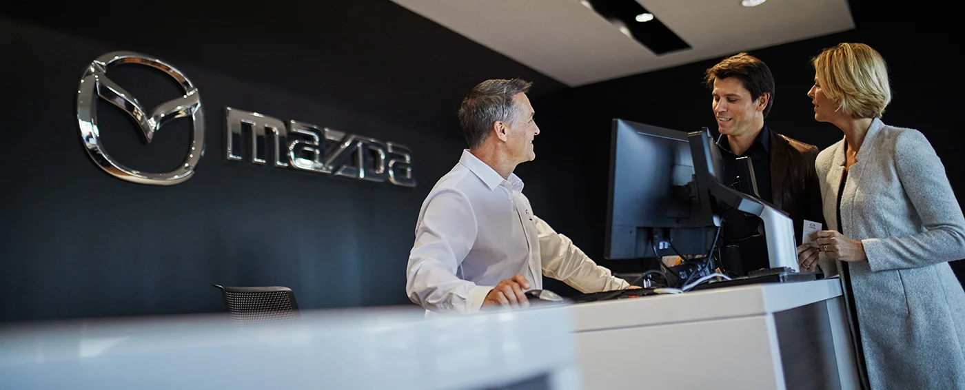 Mazda Service Consultant Assisting Customers