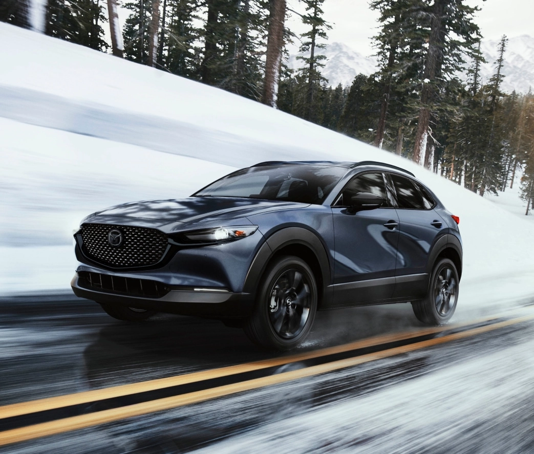 Mazda CX-30 driving on a snowy road