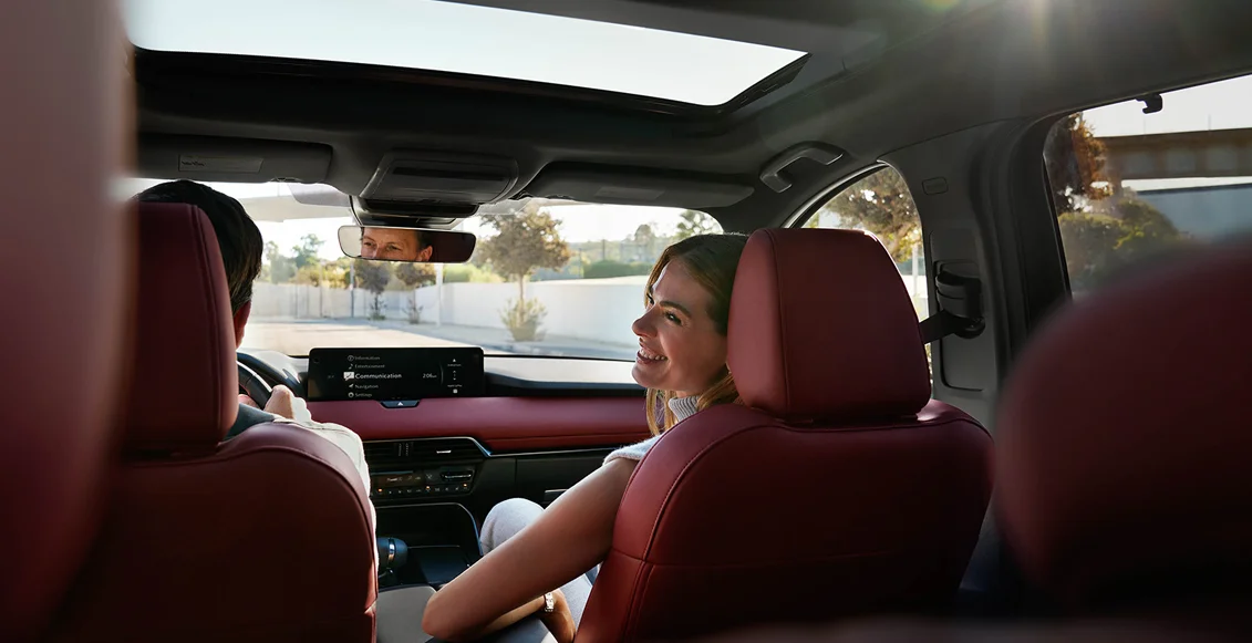 Couple driving inside a car