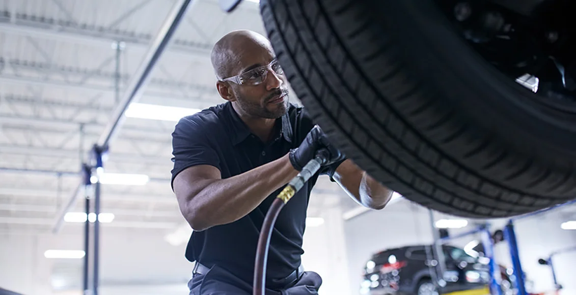 Mazda Tech working on Tires