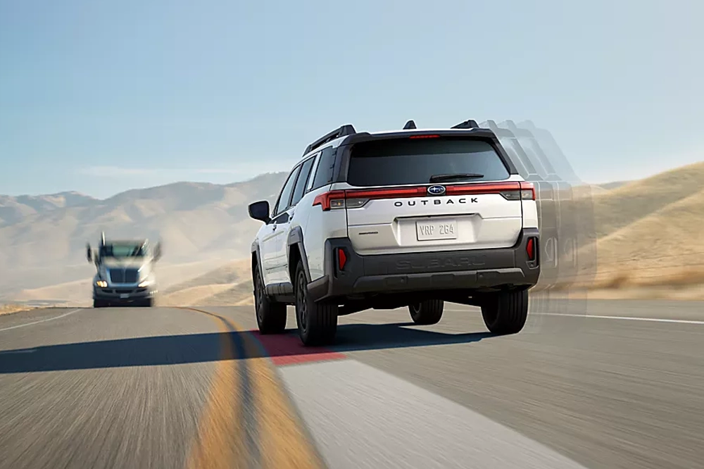 Subaru Outback driving from behind