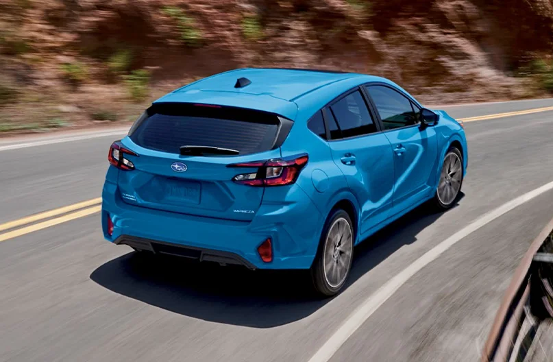 Impreza driving down the road