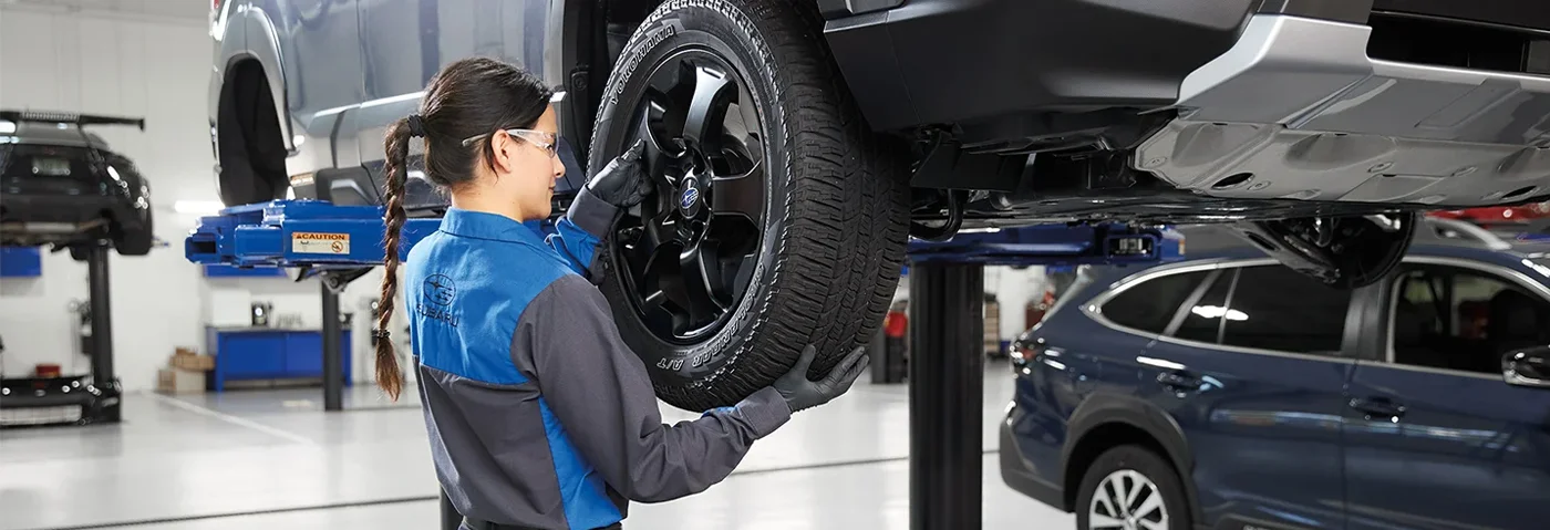 Subaru Service Tech Changing Tire