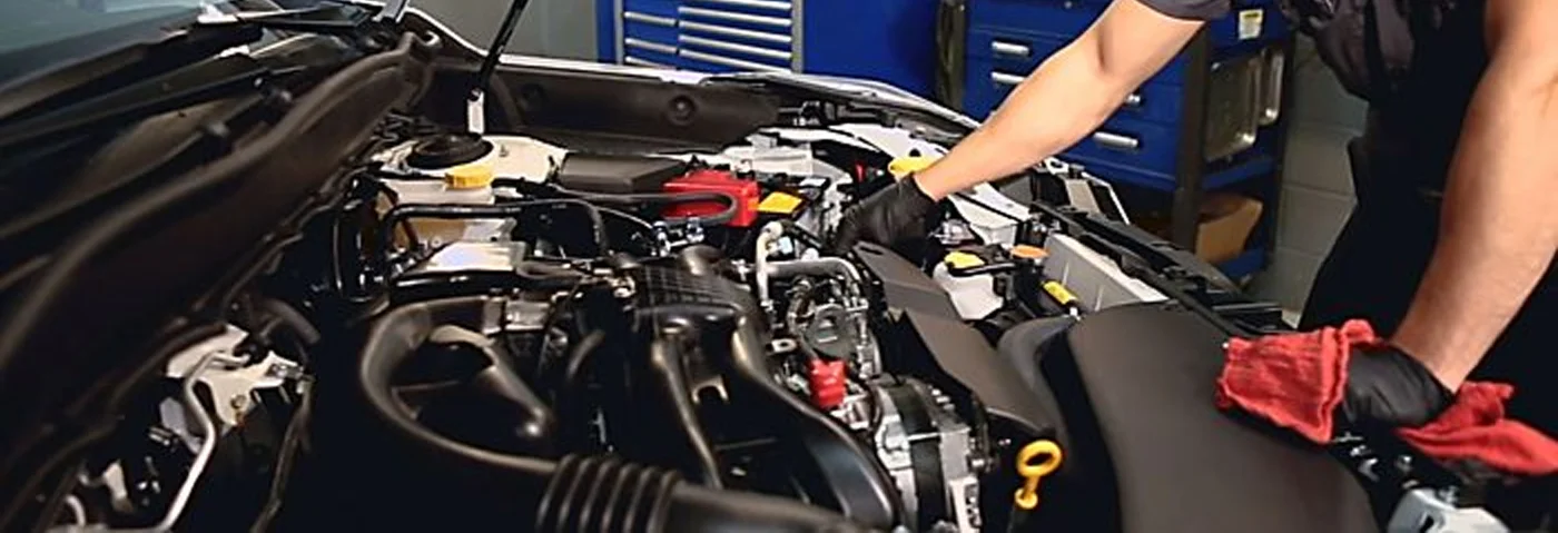 Subaru Service Tech Changing Oil