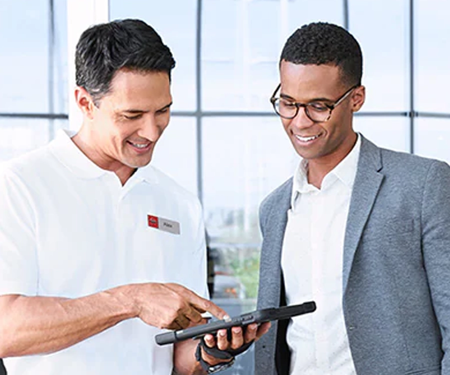 Nissan Employee Working With Customer