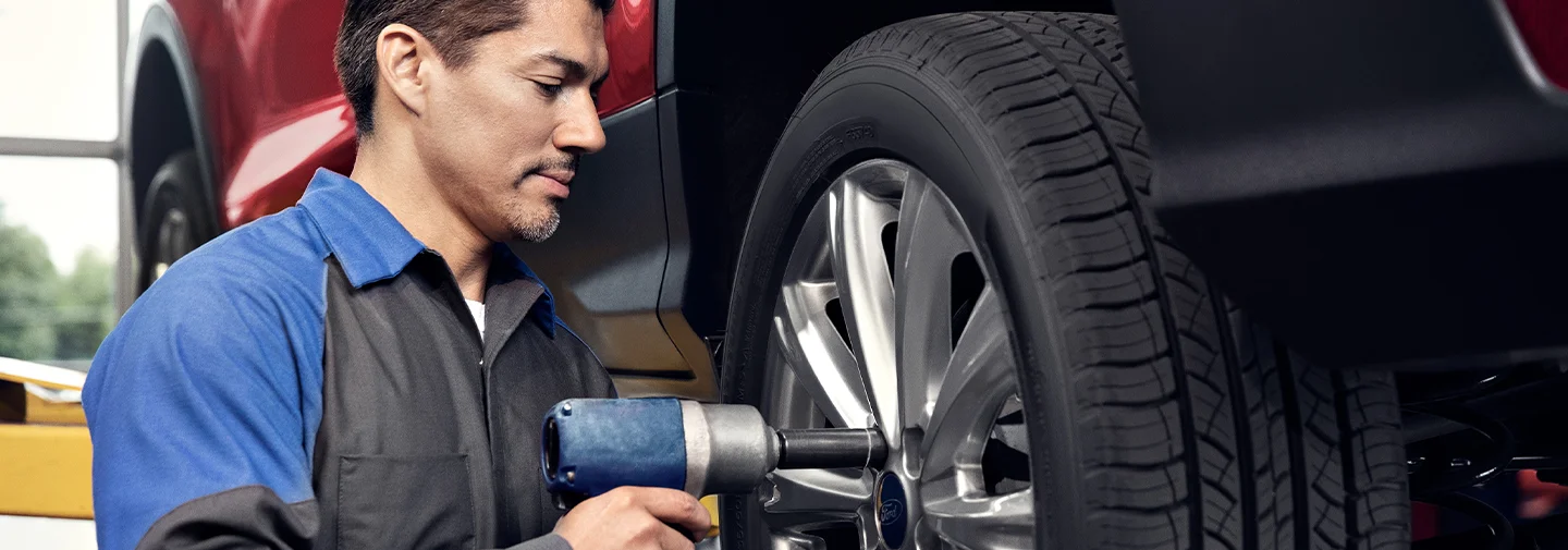 Ford Service Tech working on a car