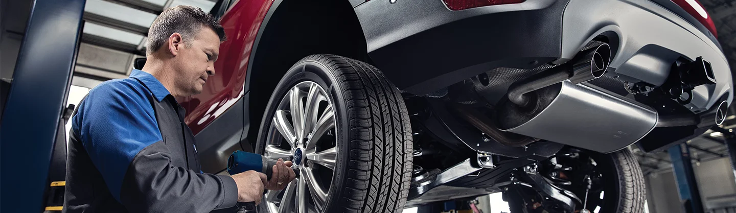 Ford Service Tech working on a car