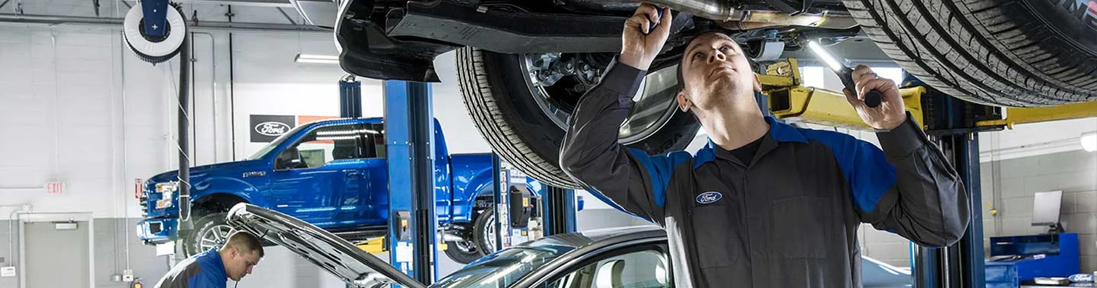 Service Tech Checking Oil