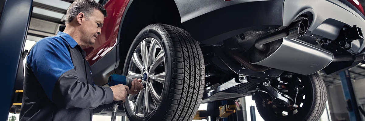 Ford Service Tech working on a car