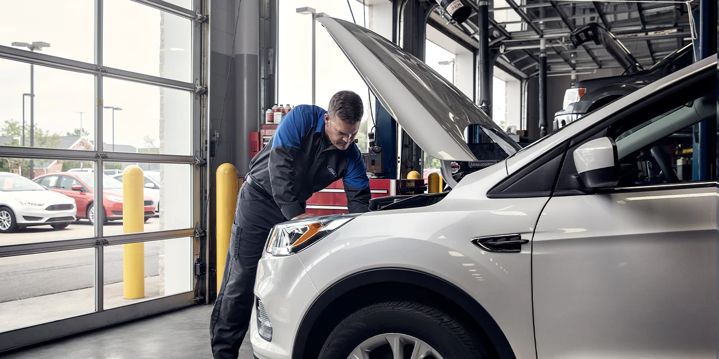 Ford Service Tech working on a car