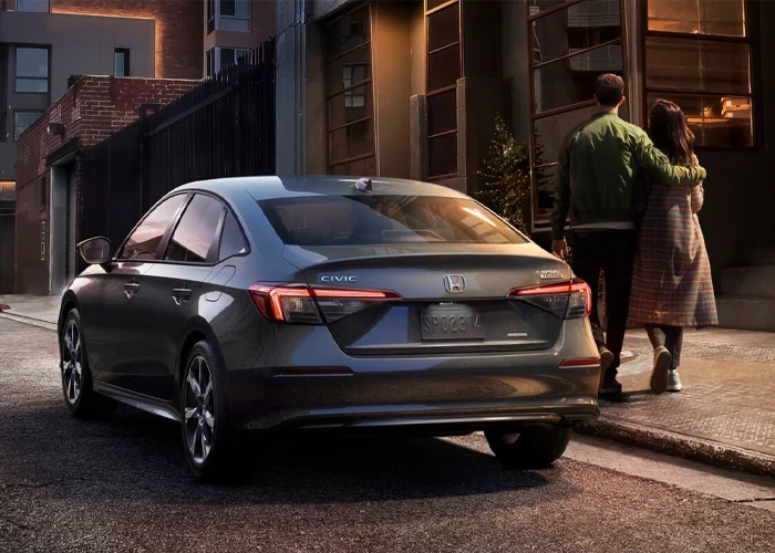 Couple Walking Past Honda Civic